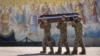 Ukraine -- Soldiers carry the coffin of their comrade, a Ukrainian military officer killed during fighting against Russians, during his funeral at St Michael cathedral in Kyiv, Ukraine, Thursday, Sept. 8, 2022. 